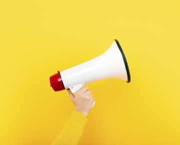 Person Holding Bull Horn