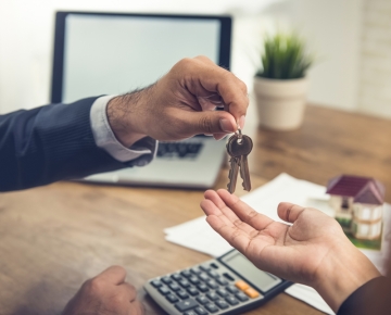 New homeowner being handed house keys