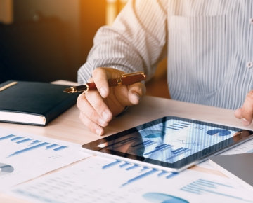 Tablet with financial documents. 