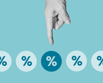 index finger pointing at circles with percentage signs against blue background