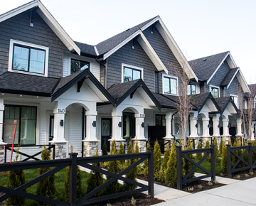 row of gray and white townhomes